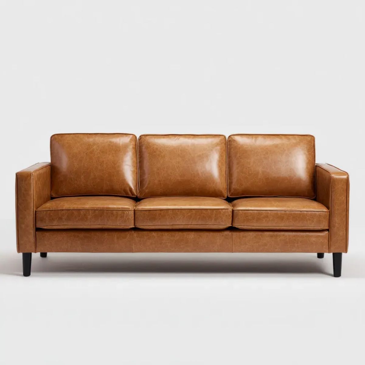 Trzyosobowa sofa ze skóry PU koniakowa z czarnymi nogami 210 x 90 x 85 cm